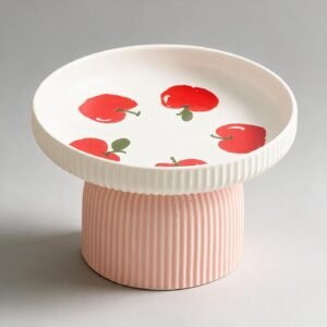 Cuenco de ceramica ancho con estampado de manzanas rojas sobre pie estriado rosa